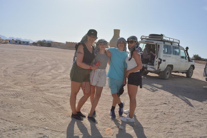 Friends by the jeep